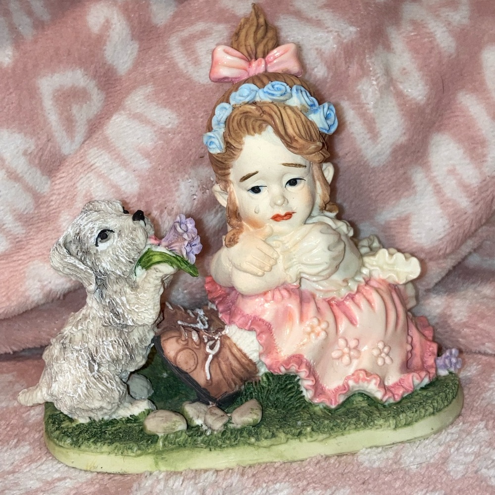 Girl crying with puppy vintage figure